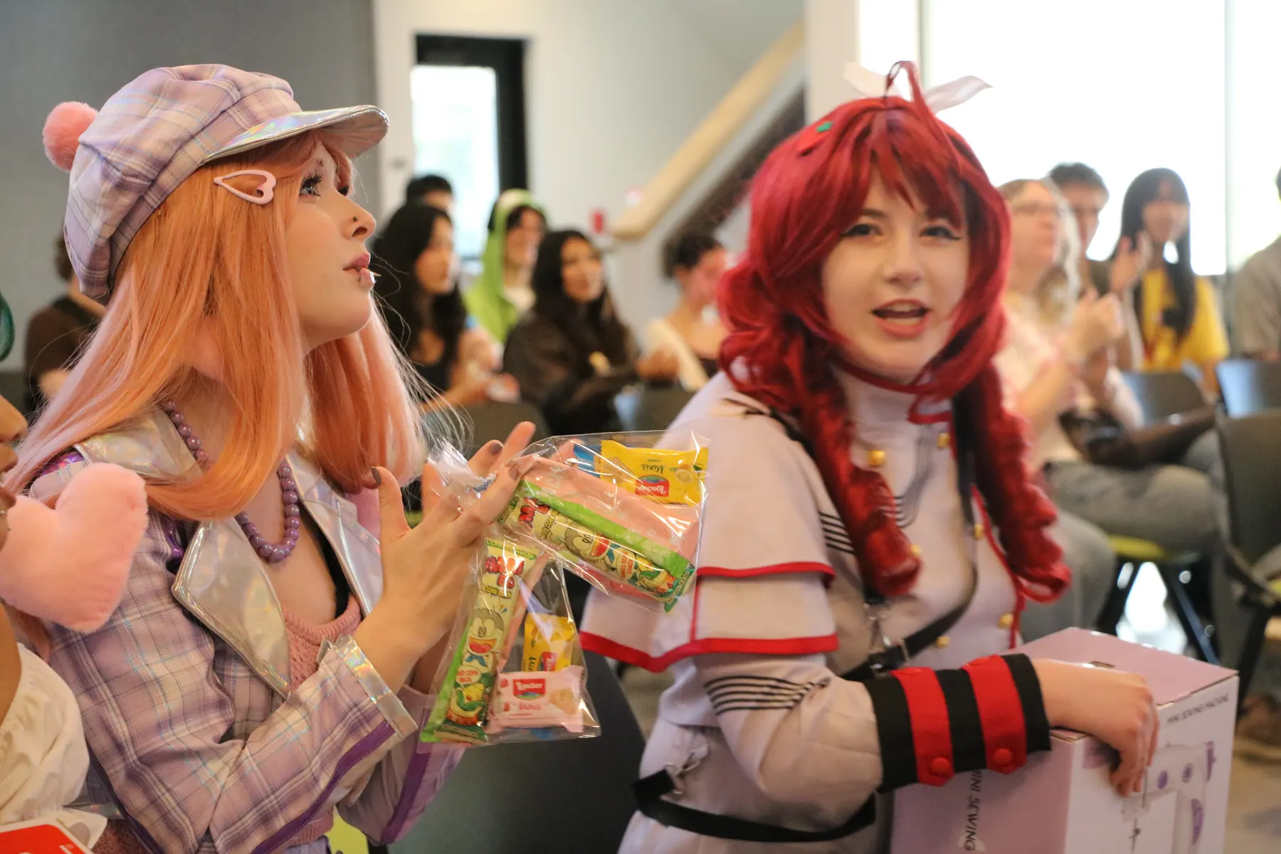 Cosplayers with prizes and snacks at SlugCon 2026